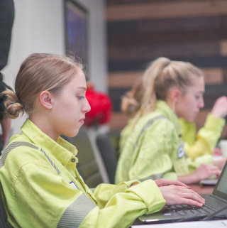 Woman in cemex uniform typing